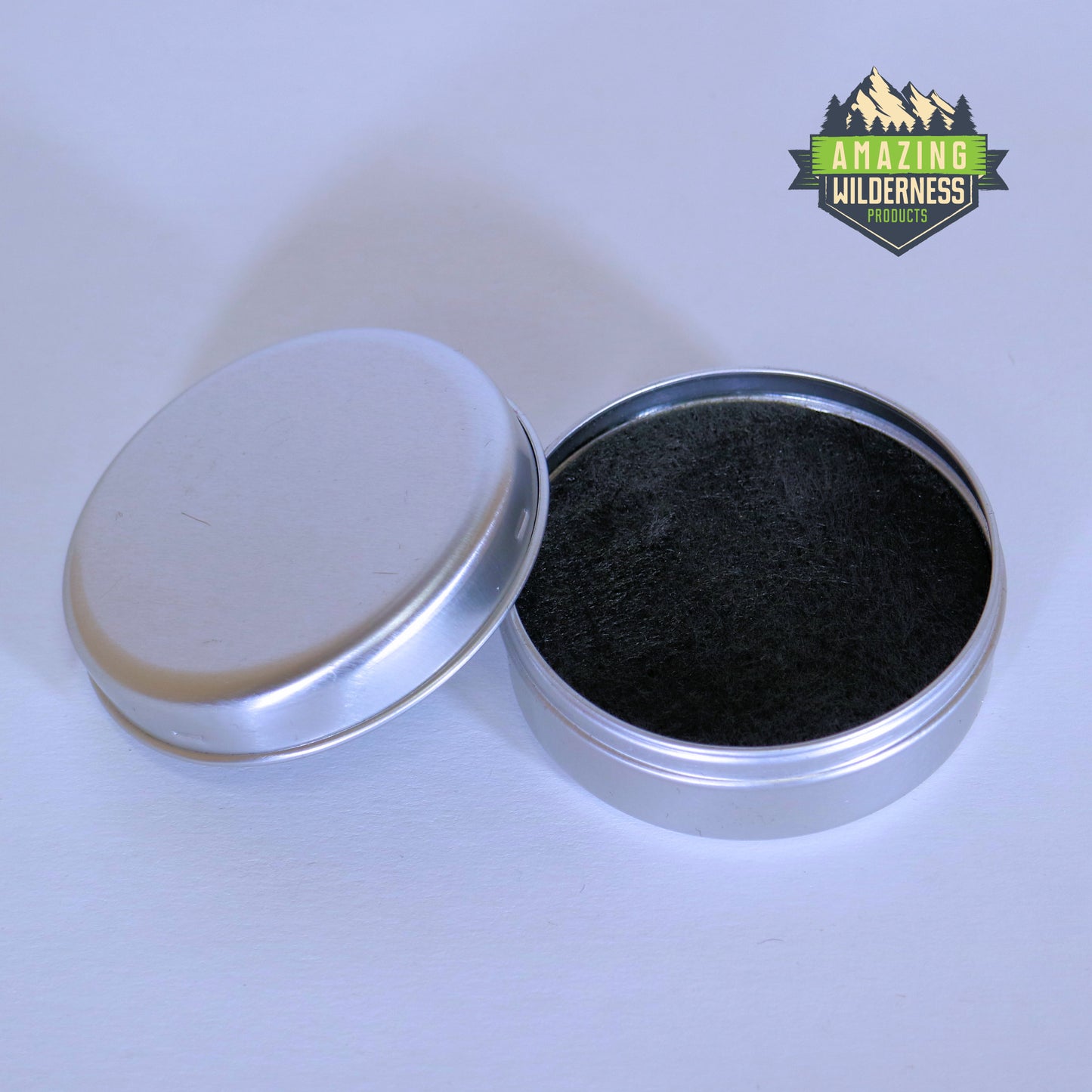 Aluminum cup with lid off showing the black carbon felt