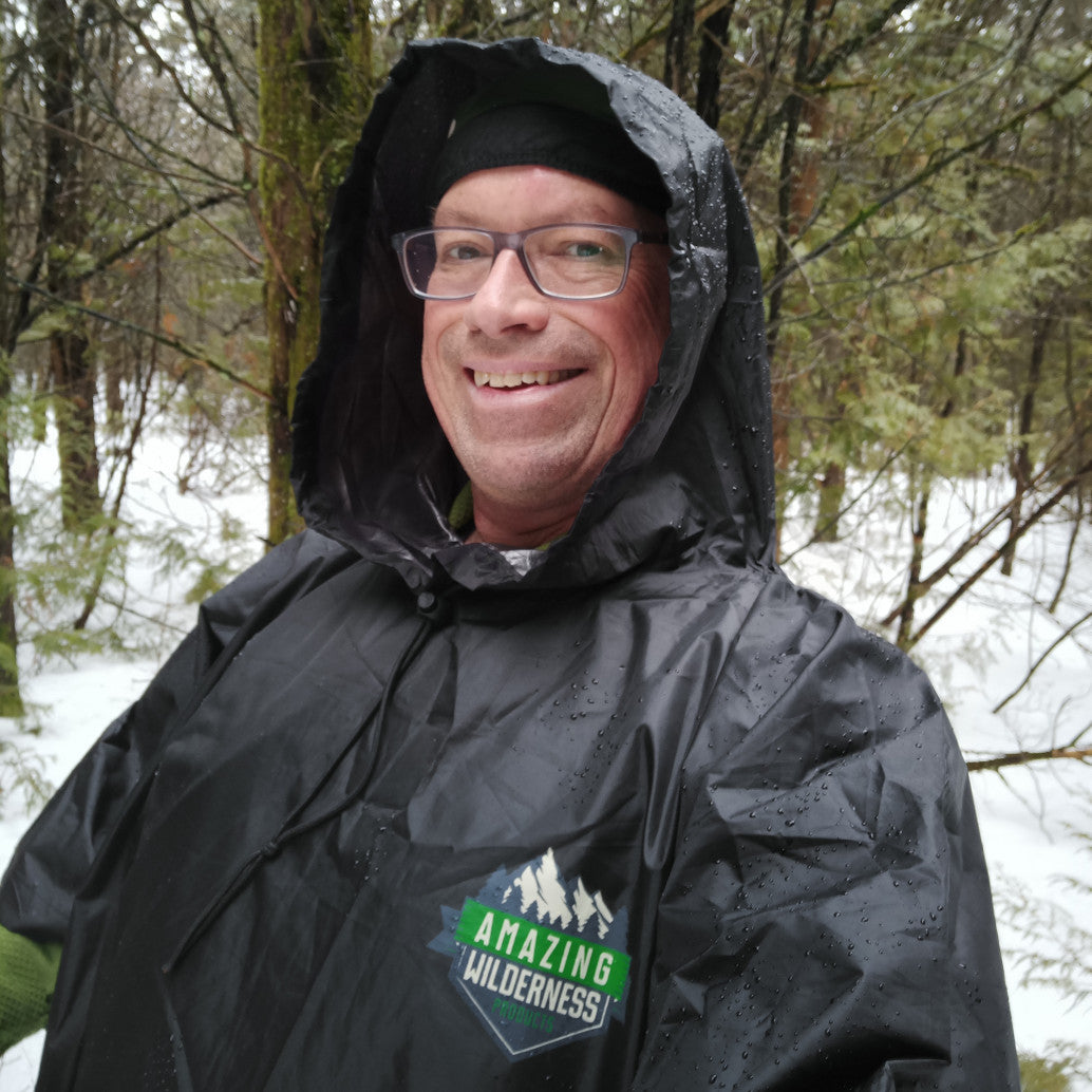 Man wearing rain poncho